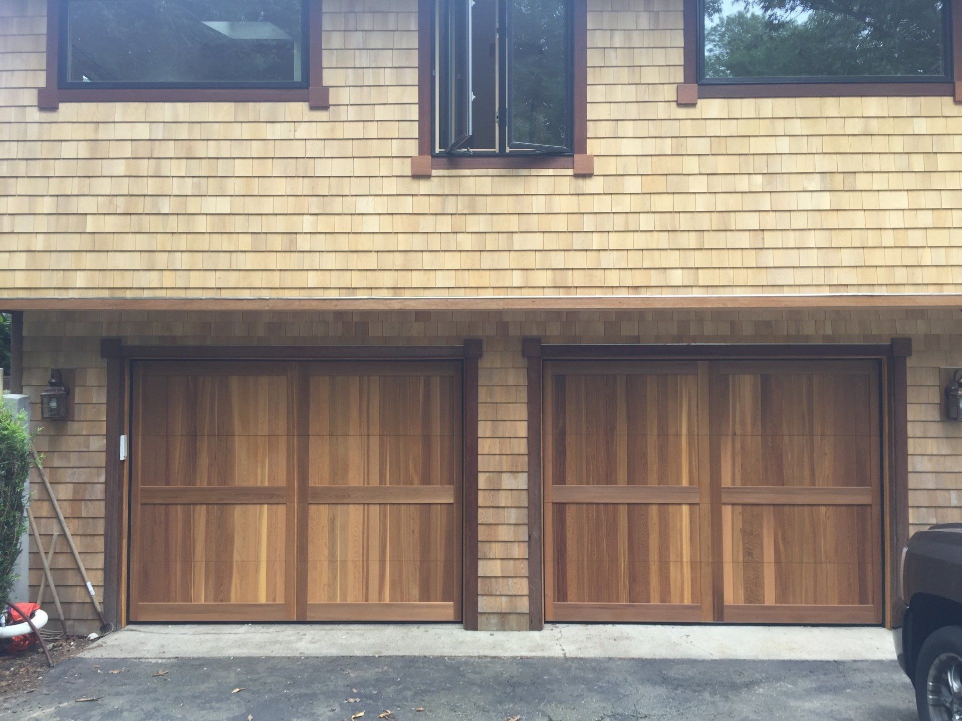 wood overlay garage door double with light bricks
