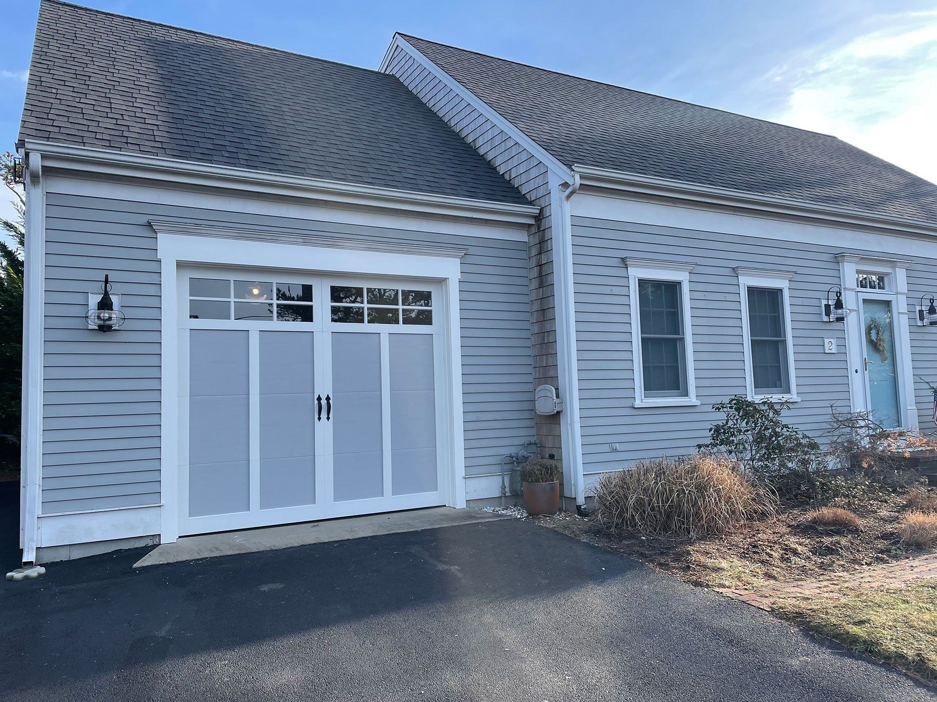 gray garage doors with white trims