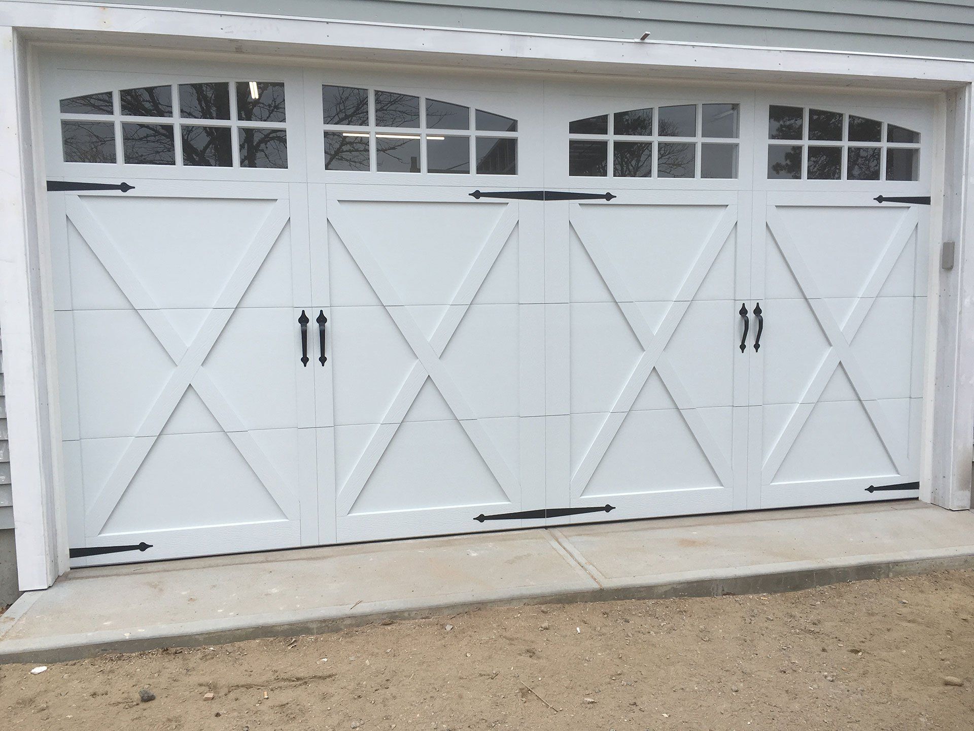 white garage door with black hardware