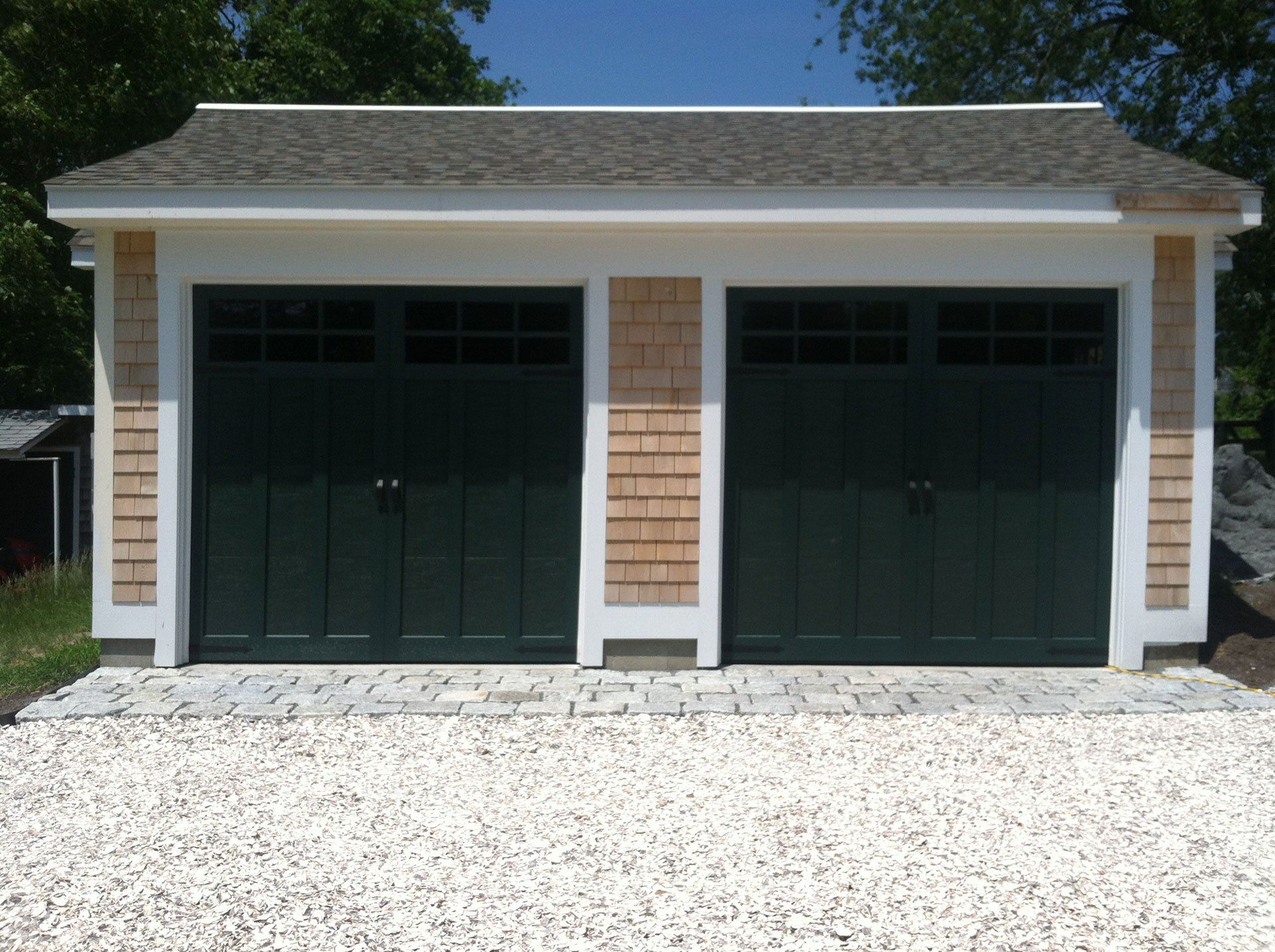 detached garage with black doors