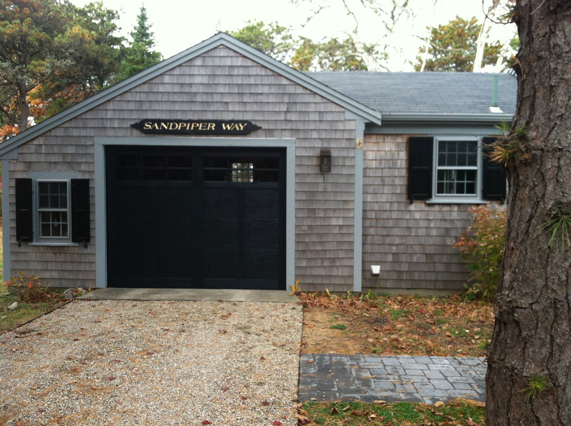 black garage doors of bungalow