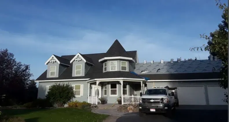 Grey house roofing remodel