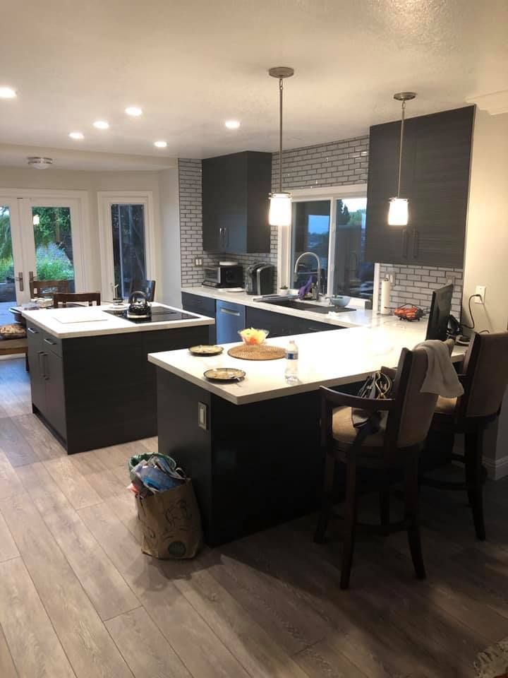 A kitchen with a large island in the middle of the room.