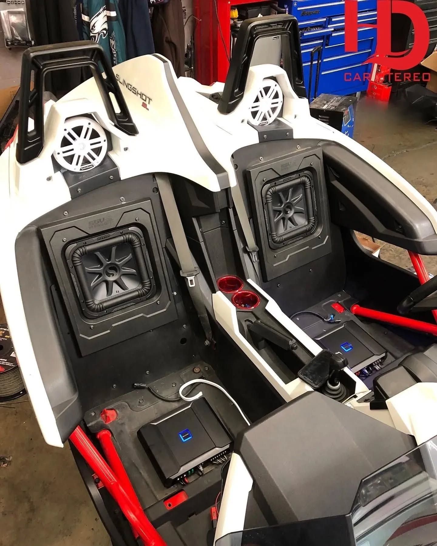 Polaris Slingshot with custom audio. White and black interior with speakers. Amplifier installed.