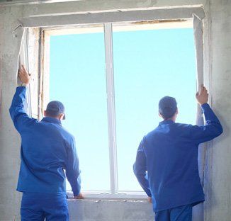 Men repairing windows