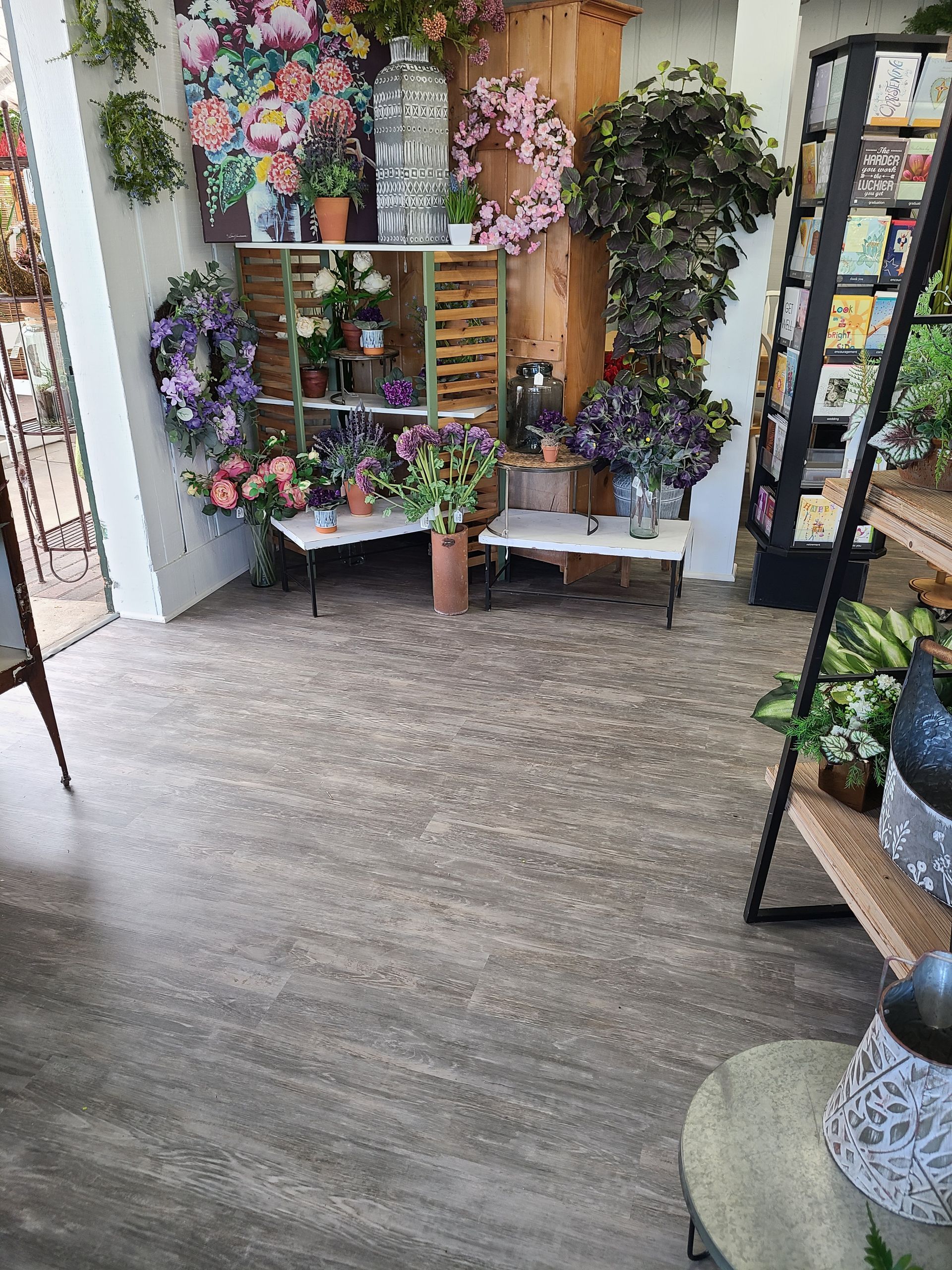 A room filled with lots of flowers and plants.