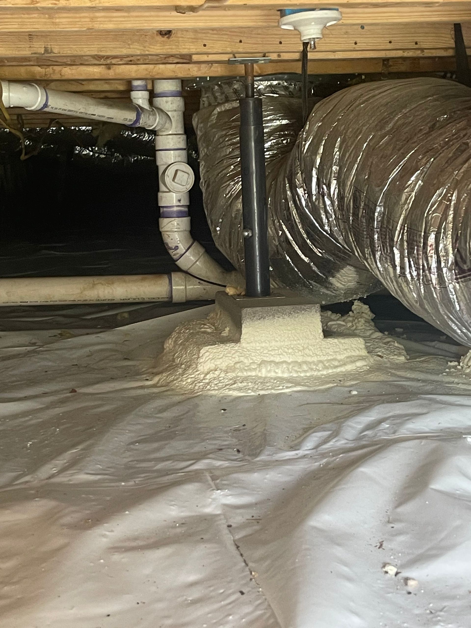 There are a lot of pipes in the crawl space.
