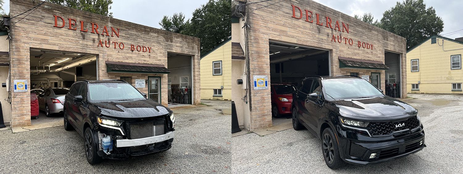 Two black SUVs parked outside of Debran's Auto. One has front-end damage.
