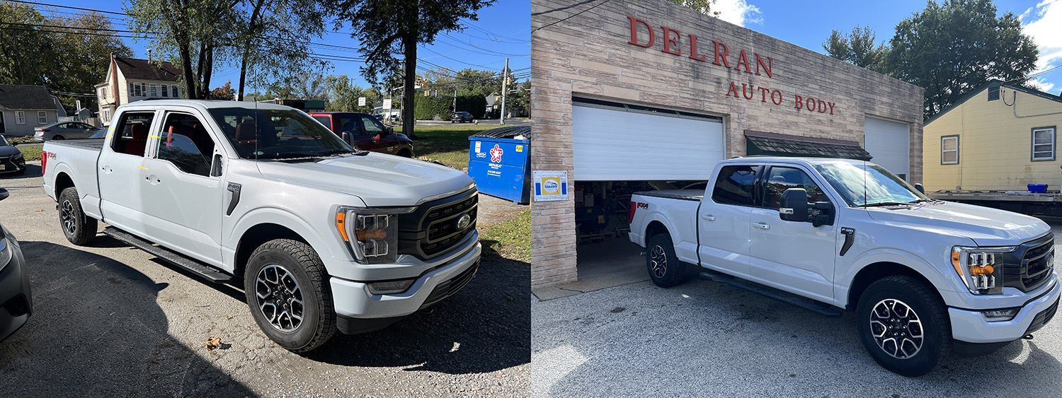 A white Ford F-150 truck parked in front of a brick building labeled 