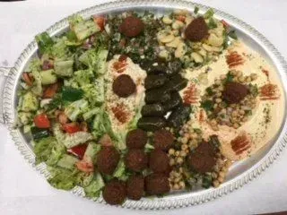 A silver tray filled with different types of food.