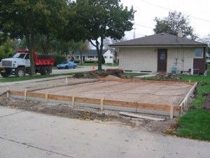 Forming for new garage slab with wire mesh and rebar in place.