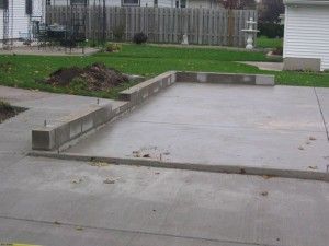 Installation of foundation block to keep garage framing above ground height.