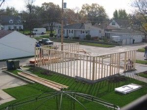 Framing of stud walls. 2 x 4’s at 16″ on-center and installation of OSB sheating.