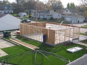 Framing of stud walls. 2 x 4’s at 16″ on-center and installation of OSB sheating.