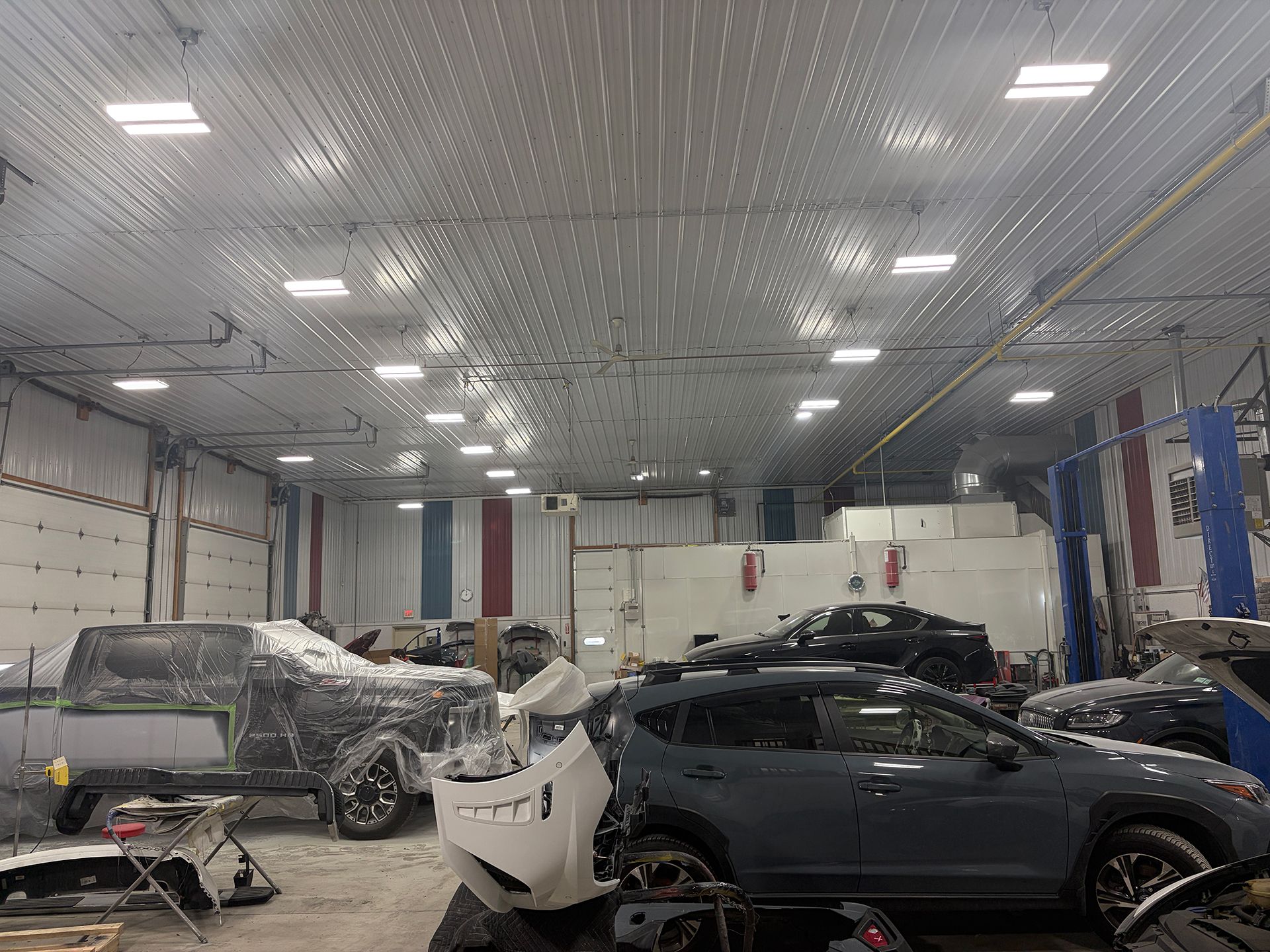 Auto repair shop with several cars parked