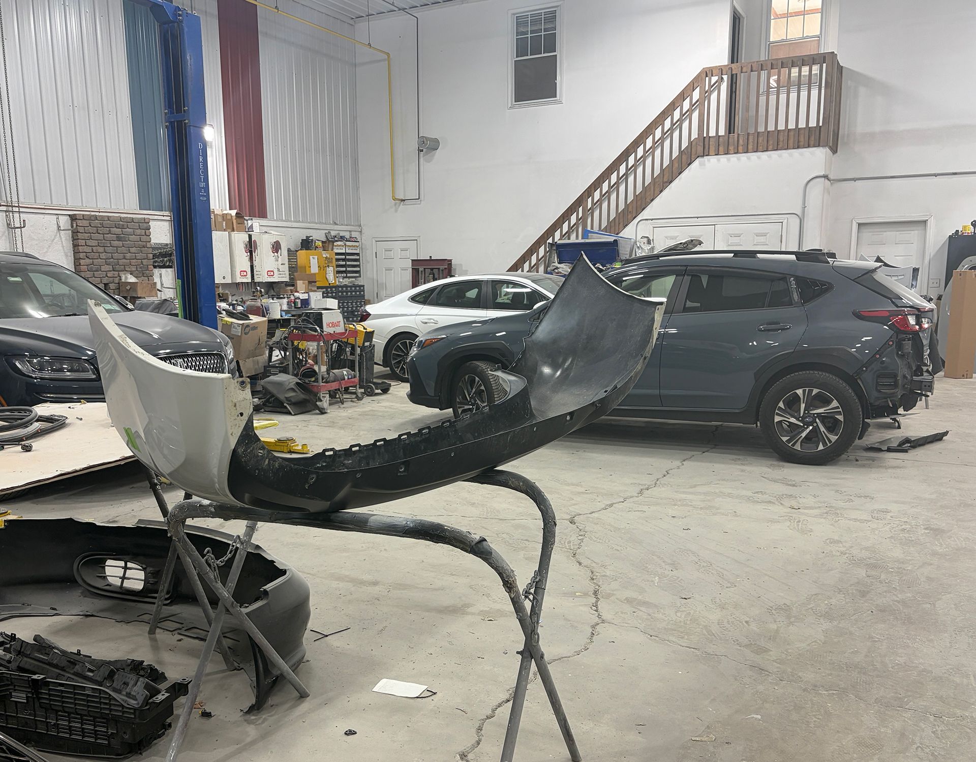 A car bumper on top of a metal stand