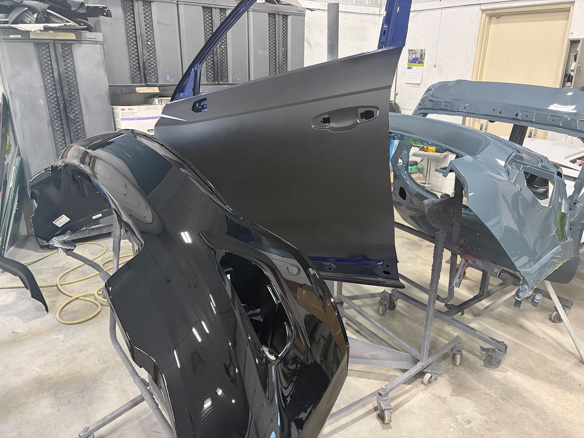 Newly painted car body panels