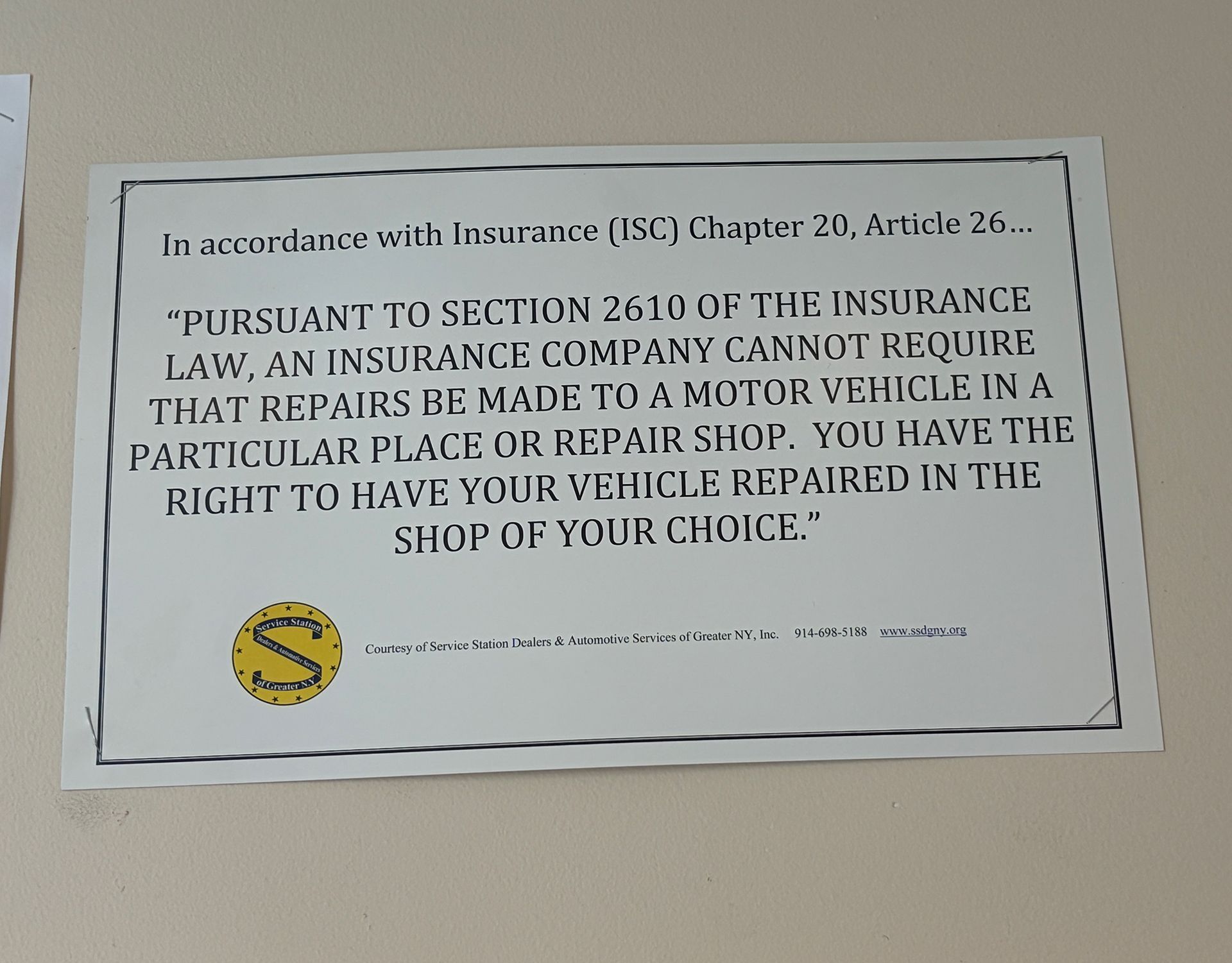 White insurance notice on wall