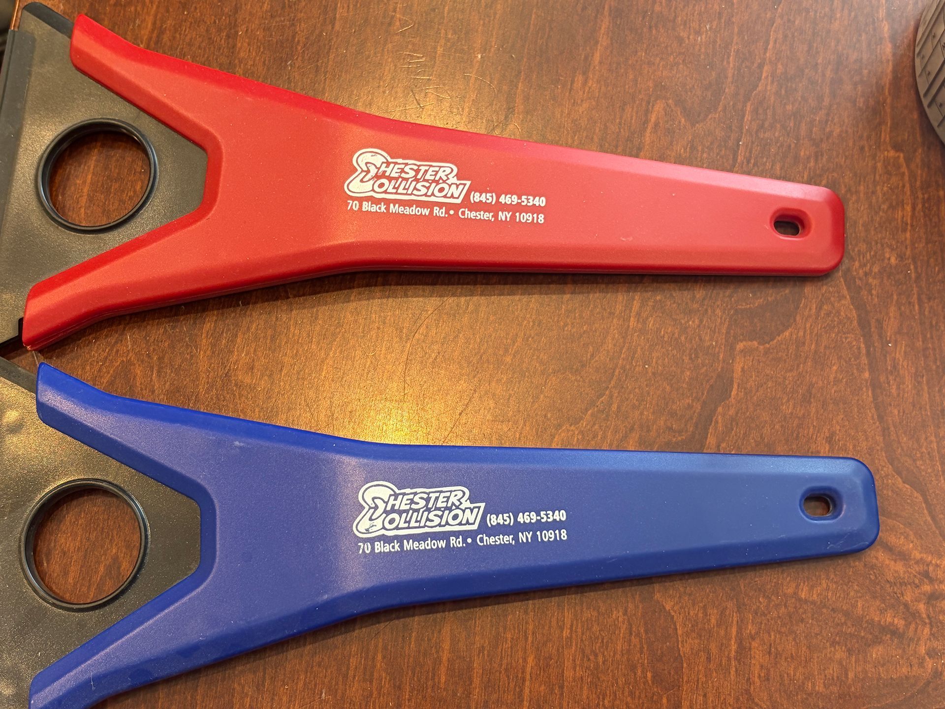 Two plastic scraper-looking objects