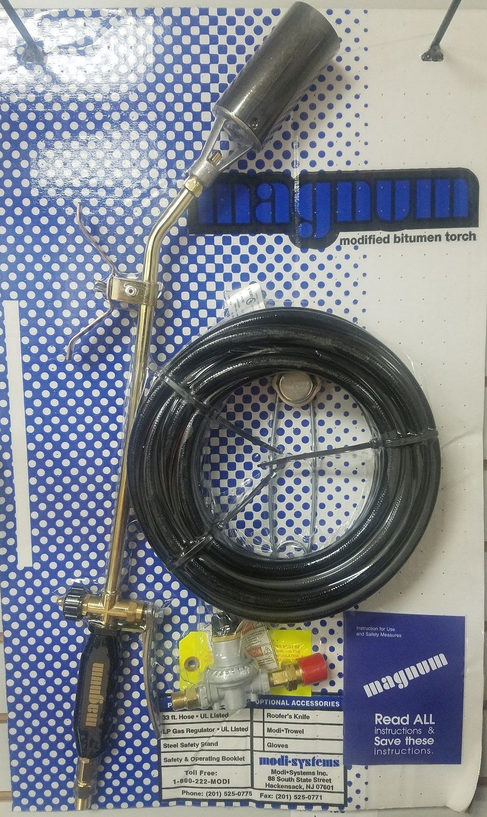 A weed burner kit with a black hose and brass torch head, displayed on a blue and white patterned background.