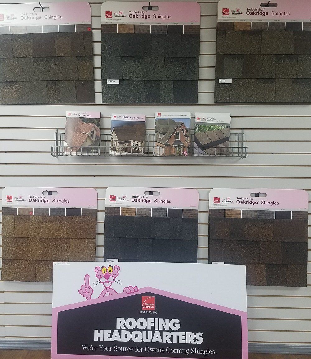 Display of roofing shingle samples from Owens Corning.