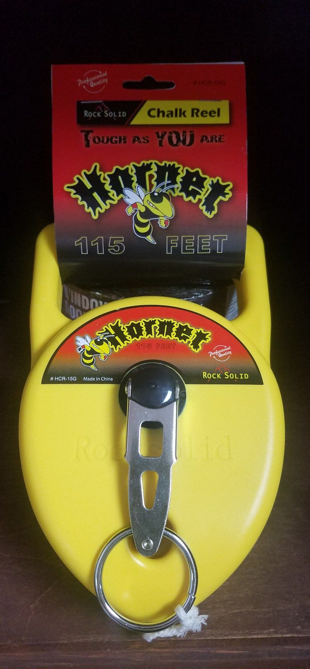 Yellow Hornet chalk reel with a red and black package.