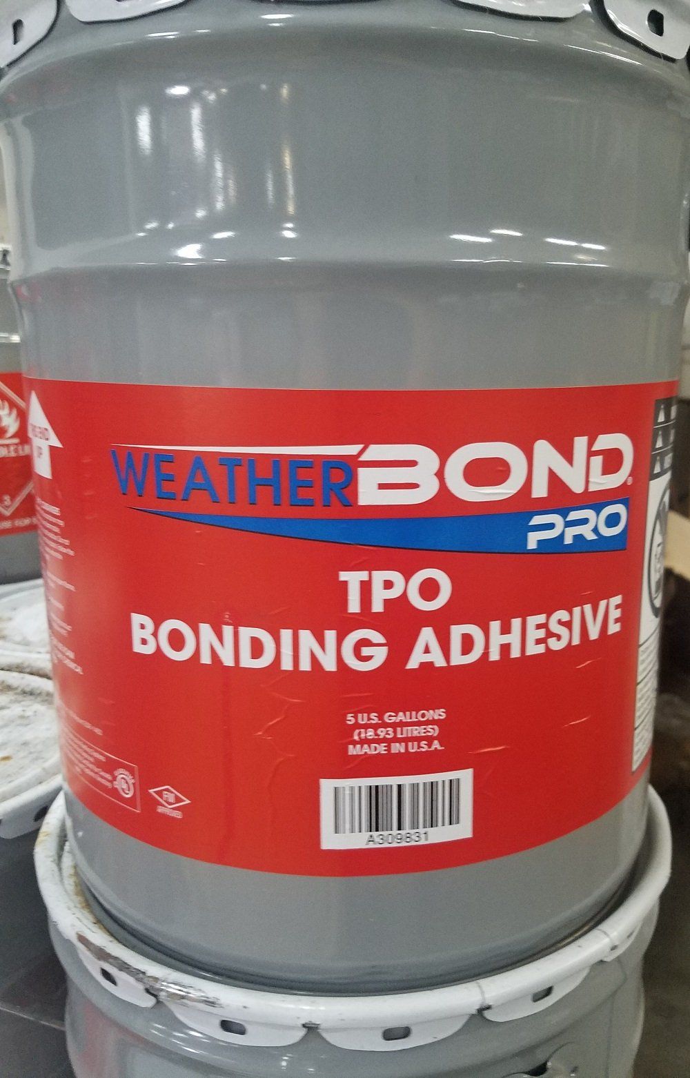 Weather Bond Pro TPO Bonding Adhesive bucket in a gray and red container.
