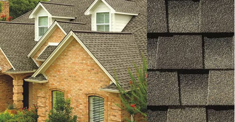 House with brown brick exterior and dark gray shingled roof, close-up of roof shingles.
