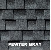 Close-up of Pewter Gray asphalt roof shingles. Gray, rectangular tiles arranged in overlapping rows.