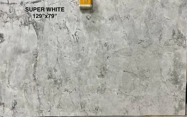 Gray-white textured wall tile sample labeled “SUPER WHITE” with dimensions 129