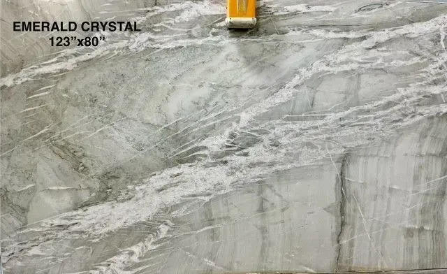 Gray marble tile with white veining, labeled Emerald Crystal 123x80, with a small yellow clip at top.