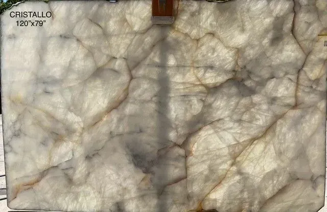 Gray and beige stone-like marble slab with cloudy veining and a small top-center notch