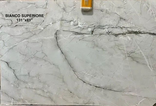 White marble slab with gray veining and “Bianco Superior” label in the top left.