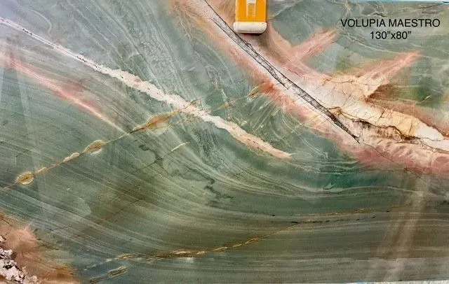 Marbled green and tan stone slab with a small label in the top right