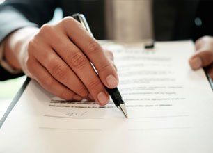 Businessman with hand putting signing contract
