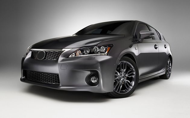 Gray sports sedan photographed in a studio, front three-quarter view