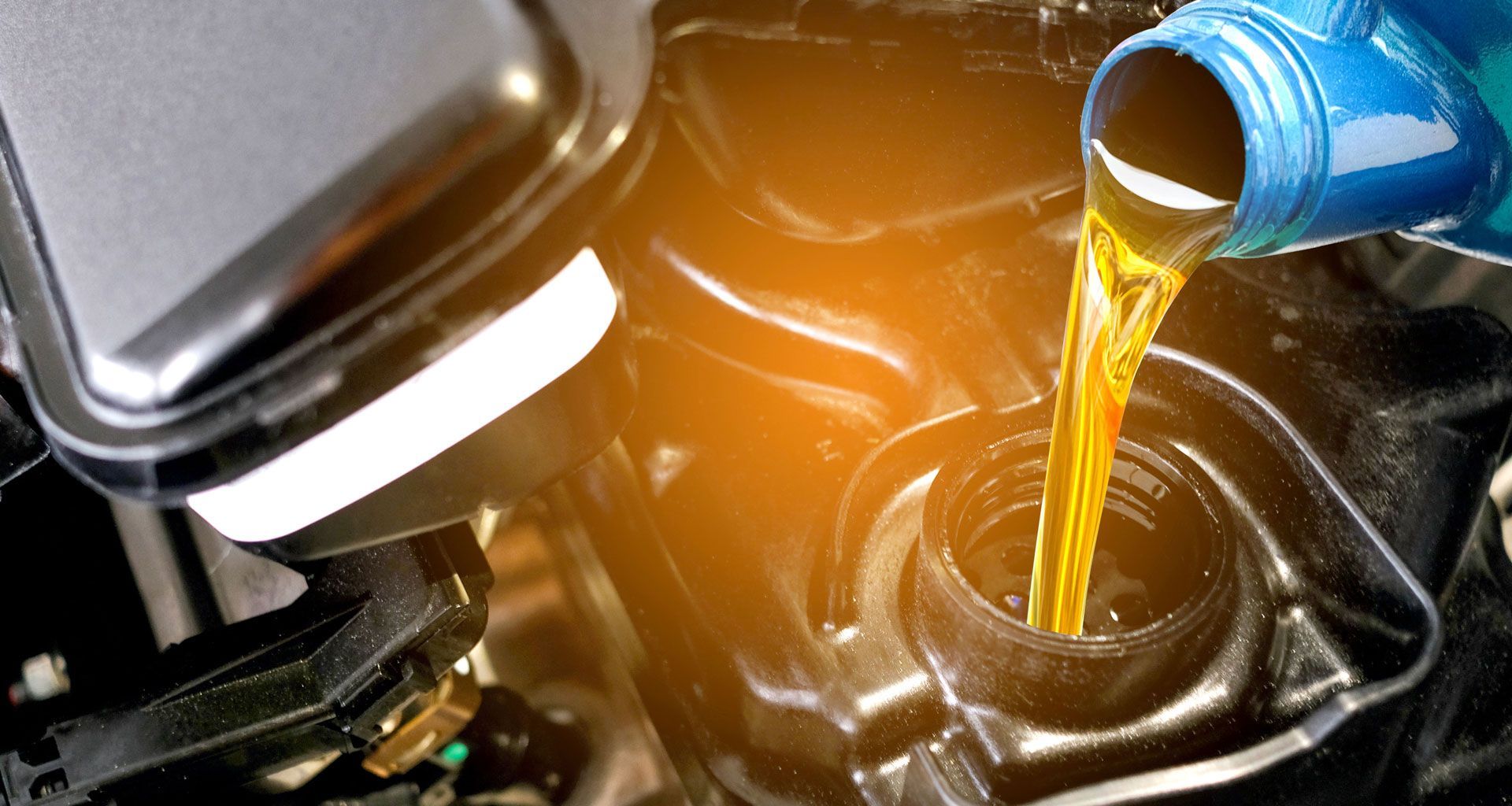 Oil being added to car engine