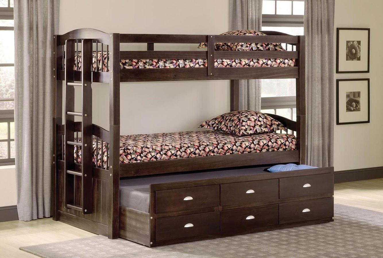 A bunk bed with drawers underneath it in a bedroom
