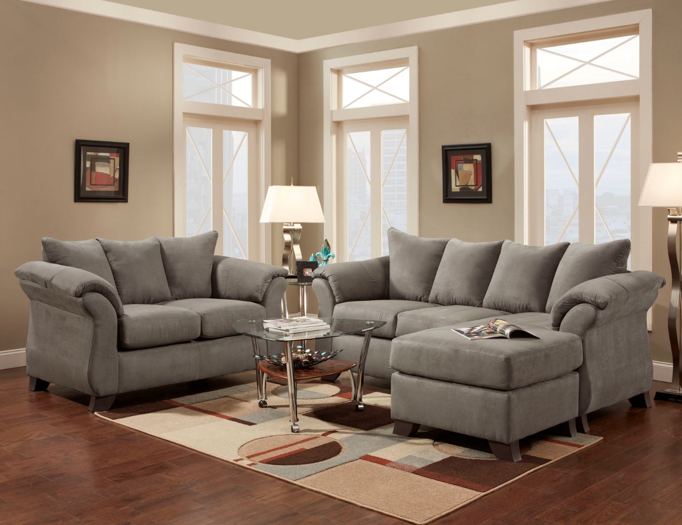 A living room with a couch , chair , and ottoman