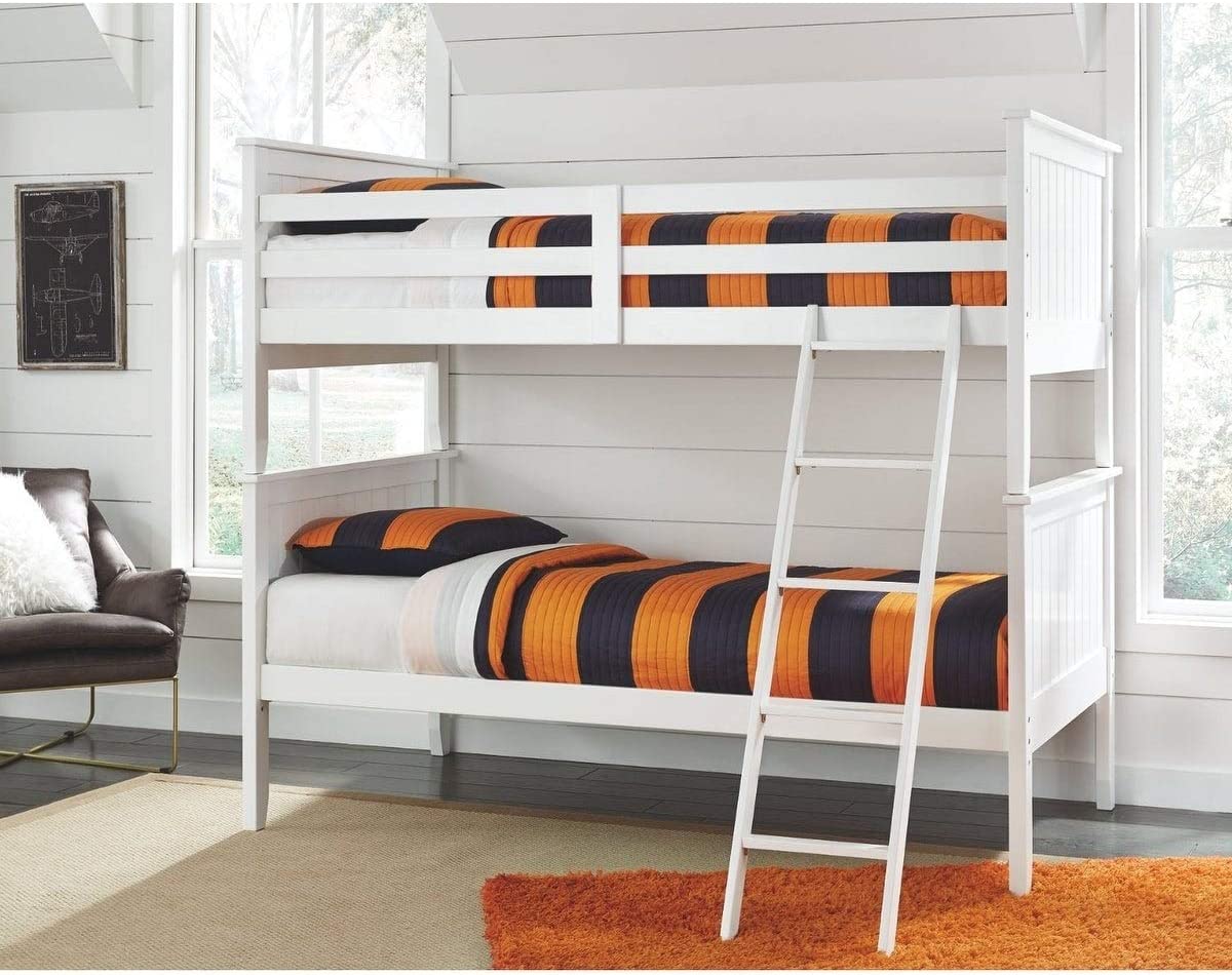A white bunk bed with an orange and black striped comforter