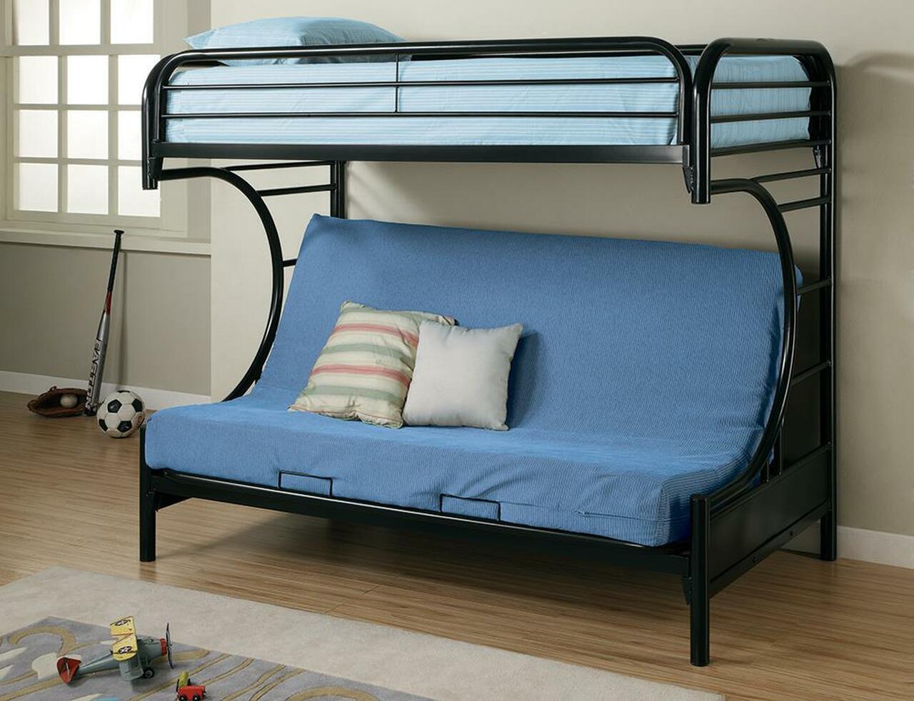 A bunk bed with a futon underneath it