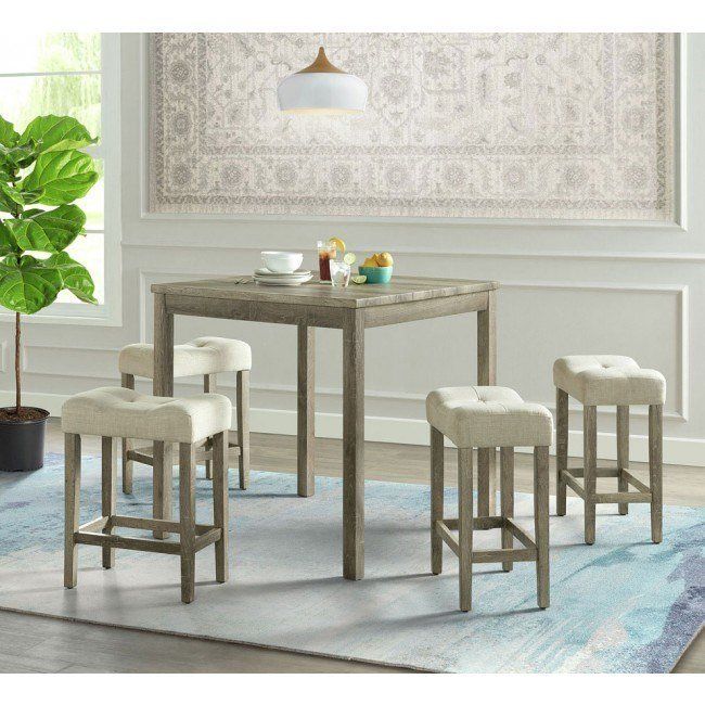 A dining room with a table and four stools