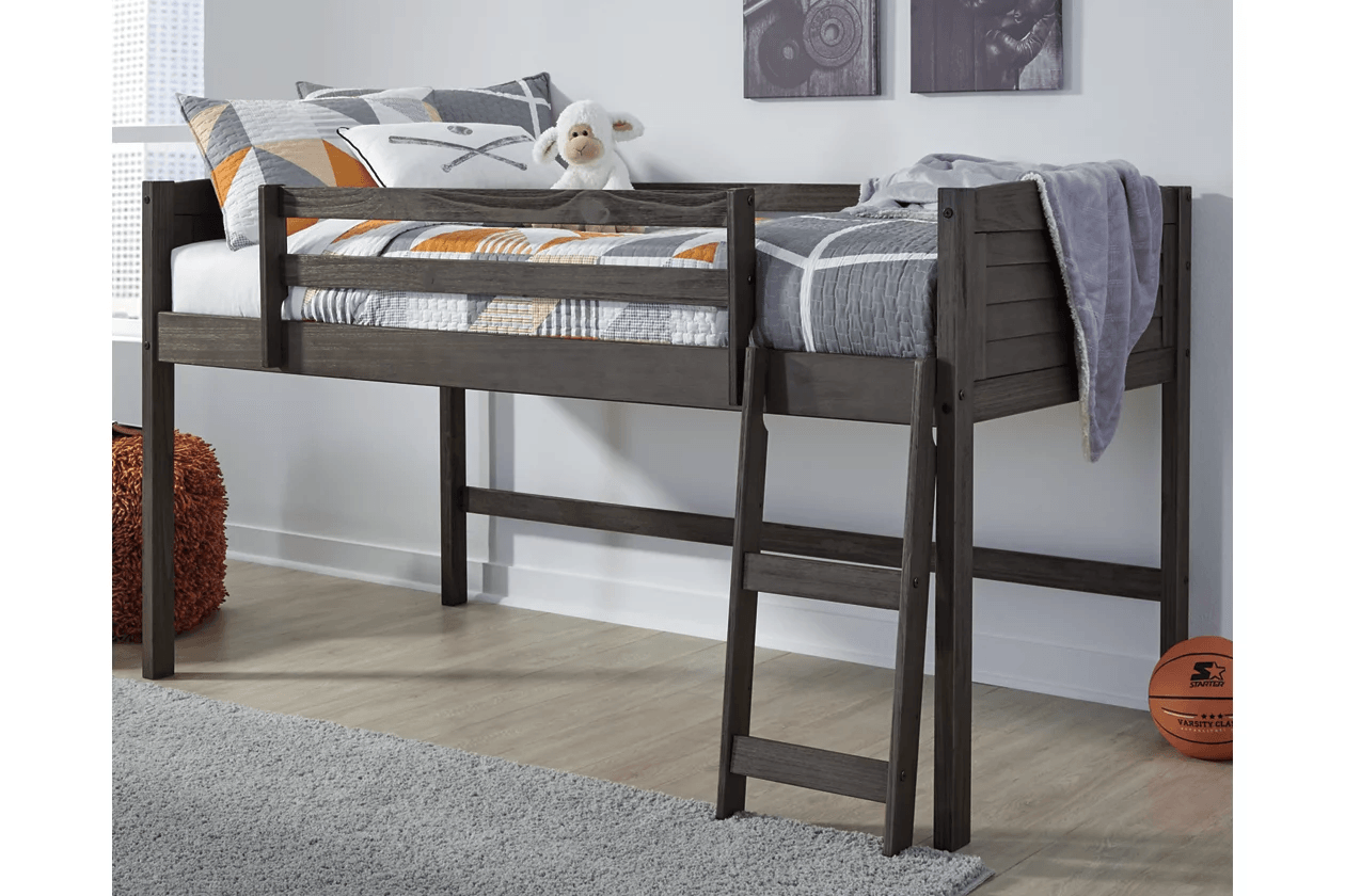 A wooden bunk bed with a ladder in a bedroom.
