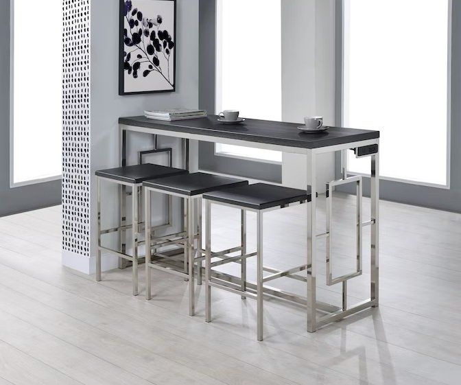 A kitchen with a table and stools and a picture on the wall