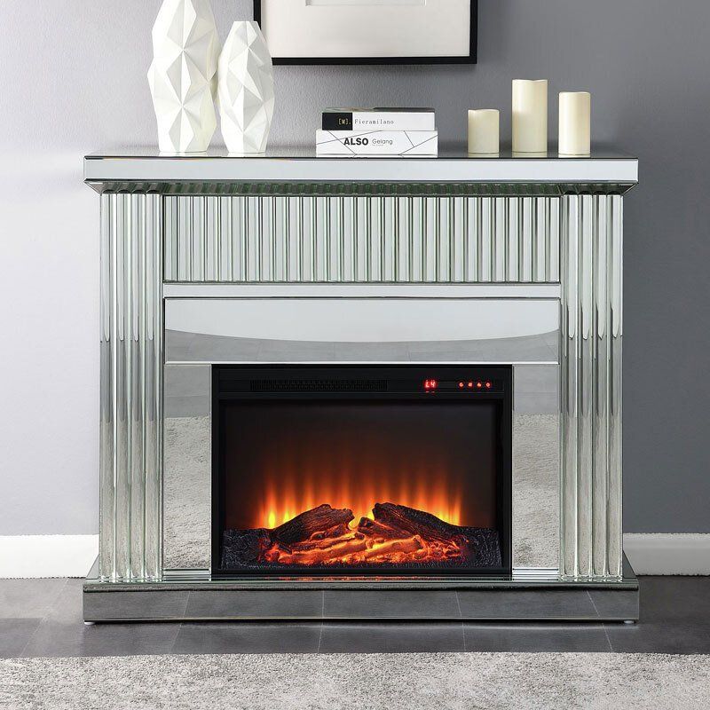 A fireplace with a mirrored mantle and candles
