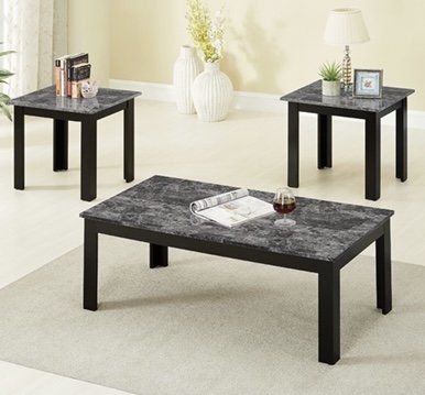 A coffee table and two end tables in a living room