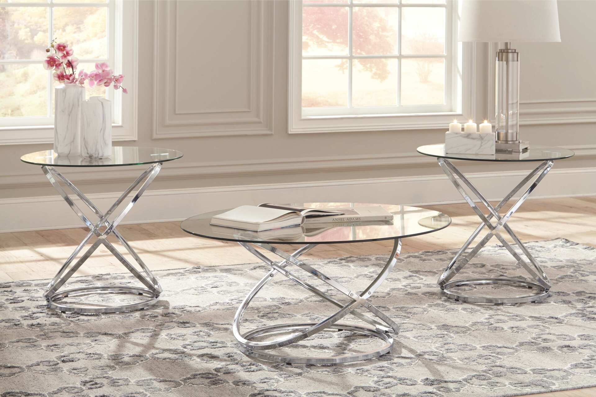 A living room with two coffee tables and a lamp.