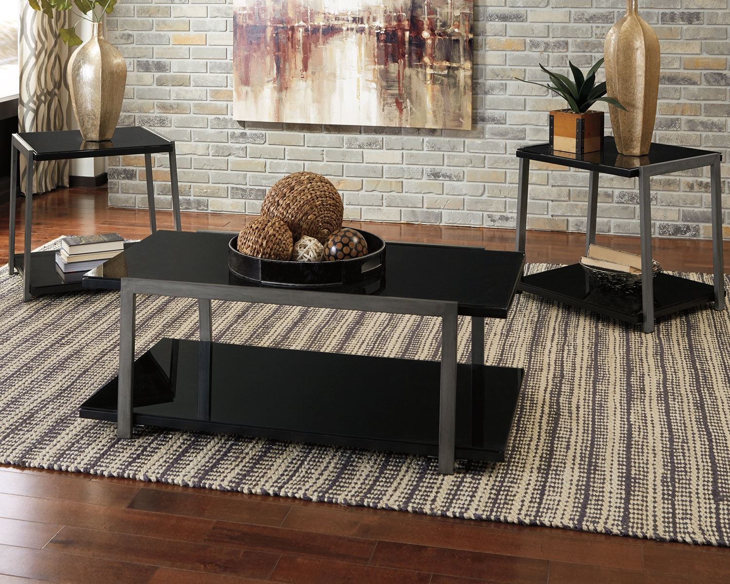 A living room with a black coffee table and two end tables