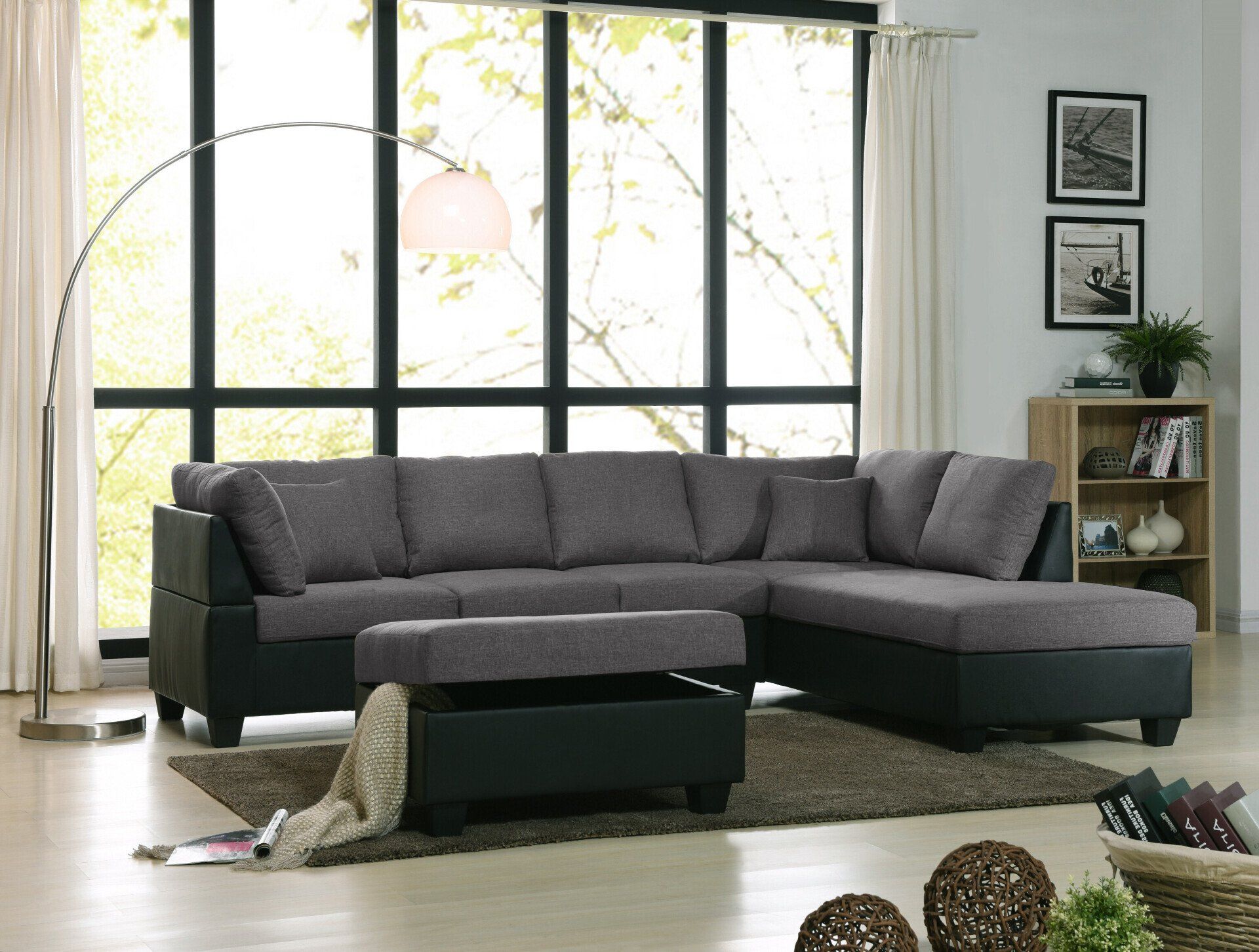 A living room with a sectional couch and ottoman
