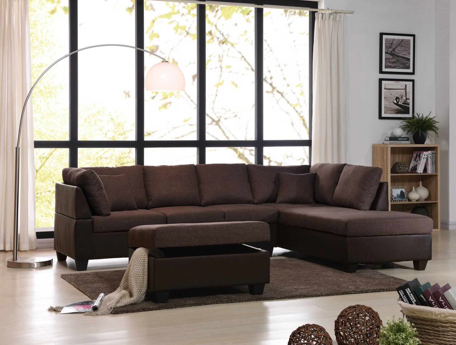 A living room with a brown sectional couch and ottoman